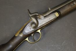A Victorian carbine with hammer action, the barrel with various proof marks,