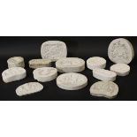 A collection of eleven various plaster pottery moulds including various Coats of Arms "Alls well