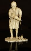 A Japanese Meiji Period carved ivory okimono as a man with large radish in his hand,