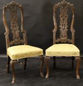 A pair of 18th Century Dutch carved walnut framed dining chairs,