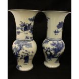 A matched pair of blue and white Chinese baluster shaped vases with flared rims,