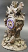 A 19th Century Black Forest type carved cased mantle clock, decorated in high relief with cockerel,
