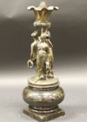 A late 19th Century French bronze figural table lamp as The Three Graces holding aloft an urn
