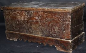 A 17th Century Italian cedar coffer, the three plank top with cleated lip support and iron hinges,