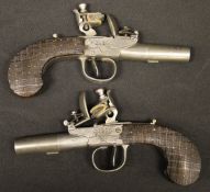 A pair of 18th Century polished steel flintlock pistols,
