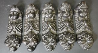 A set of five 17th or early 18th Century carved oak cherubic mouldings,