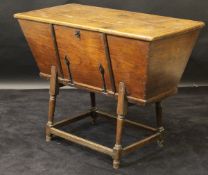 A 19th Century oak and elm dough bin, the lift plank top with cleated edge now fixed,