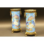 A pair of 19th Century French Creil et Montreau porcelain cylinder vases decorated with butterflies