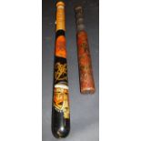 An Edwardian painted wooden truncheon with Royal cypher and crown motif and armorial inscribed
