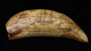 WITHDRAWN A 19th Century scrimshaw carved whale's tooth decorated with a busy whaling scene and