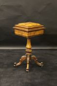 A 19th Century walnut teapoy, the moulded burr walnut lid opening to reveal a part fitted interior,