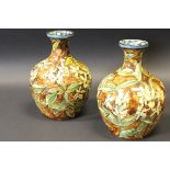 A pair of Doulton Lambeth faience vases with all over daffodil decoration,