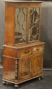 A late Regency mahogany secretaire bookcase cabinet in the Gillows manner,