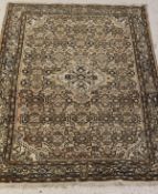 A Caucasian rug, the central medallion with all over repeating pattern on a cream ground,
