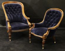 A Victorian mahogany gentleman's spoon back arm chair with buttoned upholstery over scroll arms and