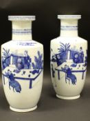 A pair of 19th Century Chinese blue and white Roulade vases,