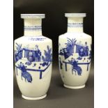 A pair of 19th Century Chinese blue and white Roulade vases,