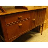 A Heal's walnut sideboard with cupboard door and two drawers, on square tapered legs,