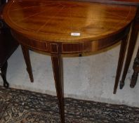 Two 20th Century mahogany demi-lune side tables in the Georgian style