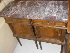 A pair of Continental mahogany and inlaid pot cupboards with drawers over cupboard doors in the