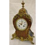 A French boulle work mantle clock with Roman numerals to the enamelled dial,