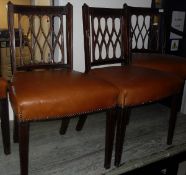 A set of four 19th Century mahogany and inlaid dining chairs with figure of 8 decorated back panels