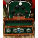 A set of four Taylor Legacy bowling bowls in hardwood case,