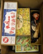 A box containing various vintage puzzles including Pictoral Map of England and six Victory puzzles