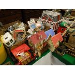 A large quantity of various Sylvanian toys including four various houses, bus, gypsy caravan,