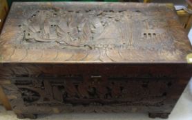 An Indonesian camphor wood lined and carved blanket chest