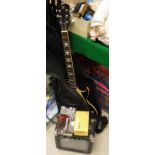 A Gibson Les Paul copy guitar marked "SXS", together with a practice amp,