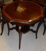 An Edwardian mahogany and inlaid octagonal occasional table on cabriole legs united by an undertier