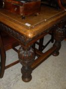 A late Victorian carved oak Elizabethan Revival refectory style table,