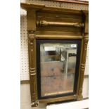 A gilt framed pier glass mirror with moulded and carved decoration together with a Military