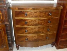 A Victorian mahogany bow fronted chest of two short over three long graduated drawers