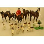 A Beswick mounted huntsman, together with nine various hounds and four various horses/foals,