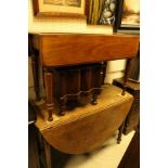 An oak drop leaf table,