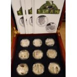 A cased collection of eighteen Queen Elizabeth II silver £5 coins