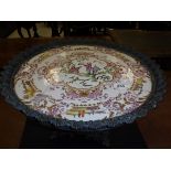 A Chinese famille-rose tazza, the centre field decorated with figures, one smoking a pipe,