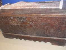 A 17th Century Italian cedar coffer, the three plank top with cleated lip support and iron hinges,