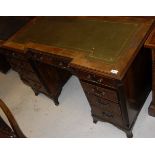 An early 20th Century mahogany breakfront pedestal desk in the Georgian style,