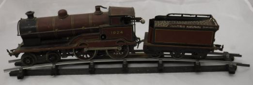 A Bing clockwork 4-4-0 locomotive and tender, finished in L.M.S.
