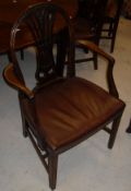 A set of six mahogany framed dining chairs in the Hepplewhite taste,