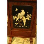 A Japanese lacquered fire screen,