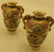 A pair of Japanese Meiji period satsuma ware baluster vases,