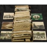 A box of various circa 1900 and early 20th Century postcards