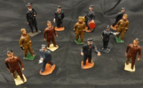A box containing various painted metal figures including three airmen, three aircraft service staff,