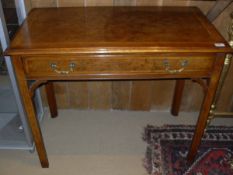 A walnut and feather banded single drawer side table in the Georgian manner,