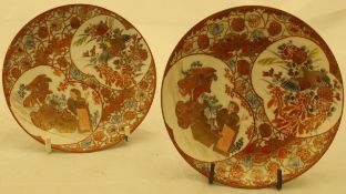 A pair of Japanese Meiji period satsuma ware saucers decorated with panels depicting bird amongst