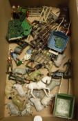 A box containing various Britains and other farmyard figures including bull and farmer,